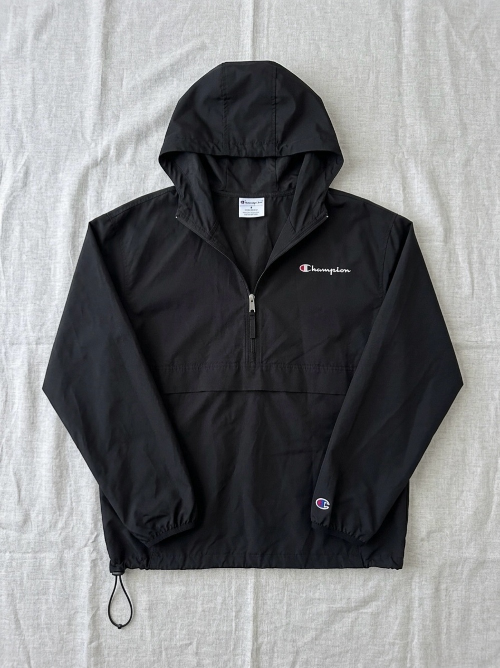 Champion Black Jacket with White Tag and Logo Accent Windbreaker